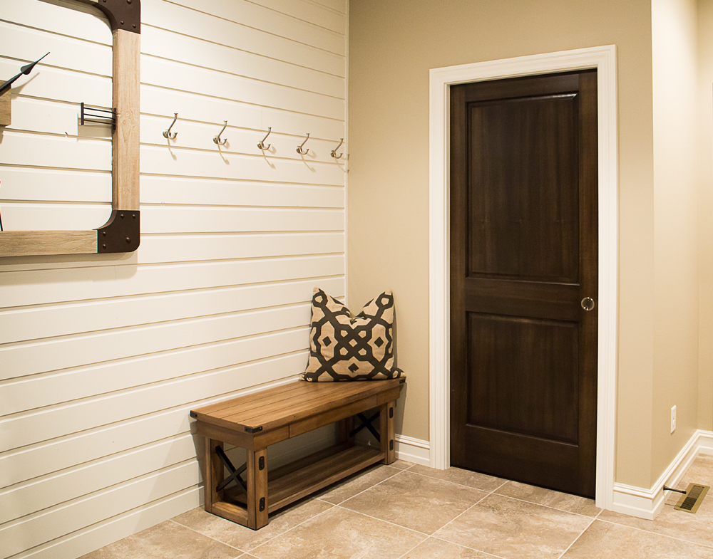 White Baseboard Trim With Dark Wood Door Iowa Remodels